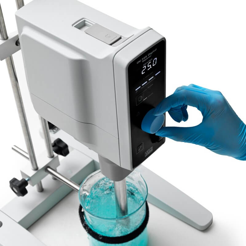  the laboratory researcher's hand changing the speed of the disperser